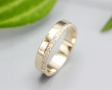 14k gold wedding ring 4 mm with diamond that extends half of the way around the high polished band