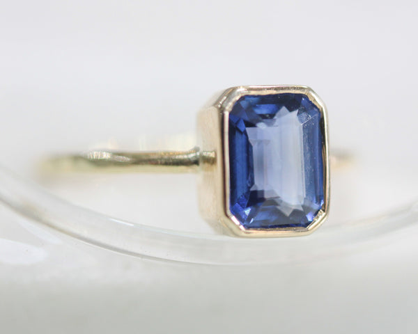 Princess cut Blue kyanite in bezel settings with 14k gold texture band