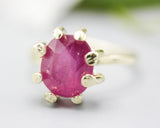 Oval red ruby cocktail ring in prongs setting with 14k gold hammer texture design band