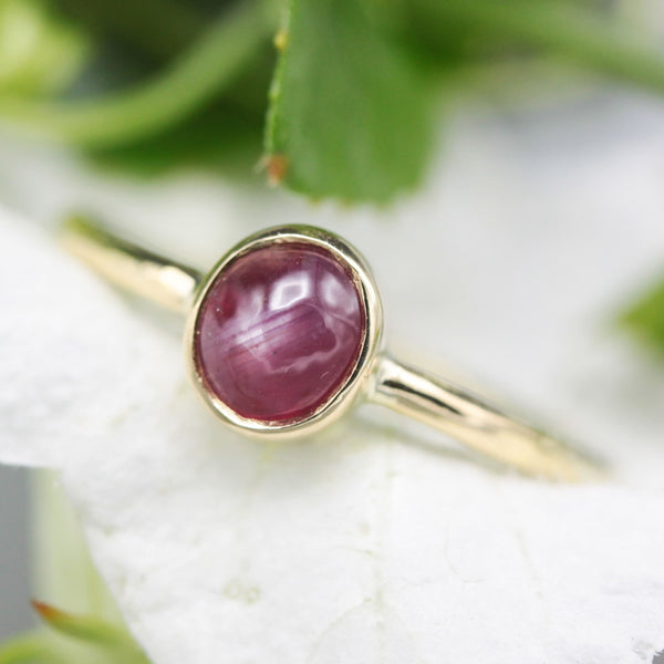Oval star ruby ring in bezel settings with 18k gold texture band