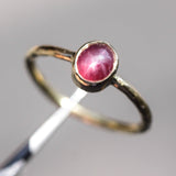 Oval star ruby ring in bezel settings with 18k gold texture band