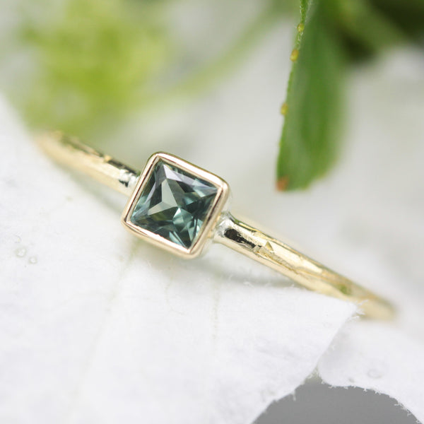 Princess cut multi green sapphire ring in bezel setting with 18k gold texture band