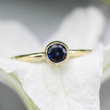 Round Blue sapphire ring in bezel settings with 18k gold texture band