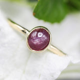 Oval star ruby ring in bezel settings with 18k gold texture band