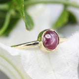 Oval star ruby ring in bezel settings with 18k gold texture band