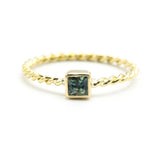 Princess cut multi green sapphire ring in bezel setting with 18k gold twist design band