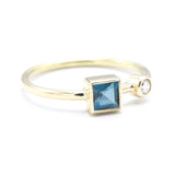 Princess cut London blue topaz ring and diamond in bezel setting with 18k gold high polished band