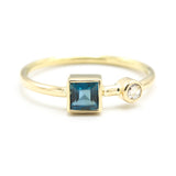 Princess cut London blue topaz ring and diamond in bezel setting with 18k gold high polished band