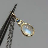 Oval Moonstone, square blue sapphire and Princess cut Diamond in 18k gold bezel settings with oxidized sterling silver chain