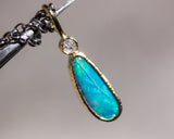 Australian opal and round Diamond in 18k gold bezel settings with oxidized sterling silver chain