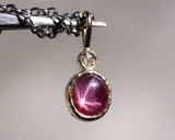 Star Ruby and round Diamond in 18k gold bezel settings with oxidized sterling silver chain
