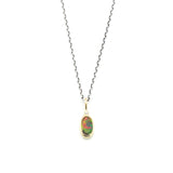 Oval faceted black Opal and round Diamond in 18k gold bezel settings with oxidized sterling silver chain