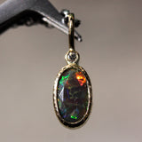 Oval faceted black Opal and round Diamond in 18k gold bezel settings with oxidized sterling silver chain