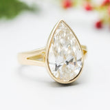 Teardrop Lab diamond ring in bezel setting with 18k gold high polish band