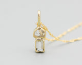 Princess cut Diamond and Sliced es diamond in 18k gold bezel settings with 18k gold chain