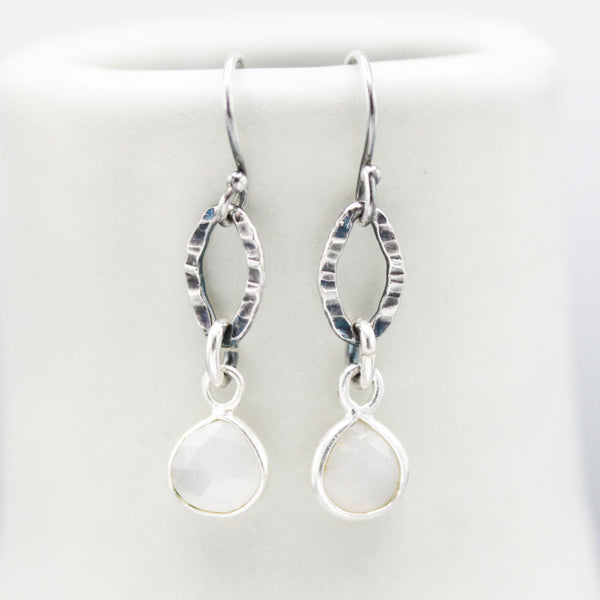 White Moonstone earrings in silver bezel setting with oxidized sterling silver hooks style