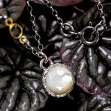 White Moonstone pendant necklace in silver bezel setting with oxidized sterling silver chain