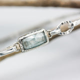 Paraiba Kyanite bangle bracelet in silver bezel setting with sterling silver high polish finished band