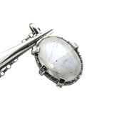 Cabochon Moonstone pendant necklace in silver bezel and prongs setting