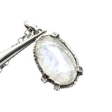 Oval moonstone pendant necklace in silver bezel and prongs setting