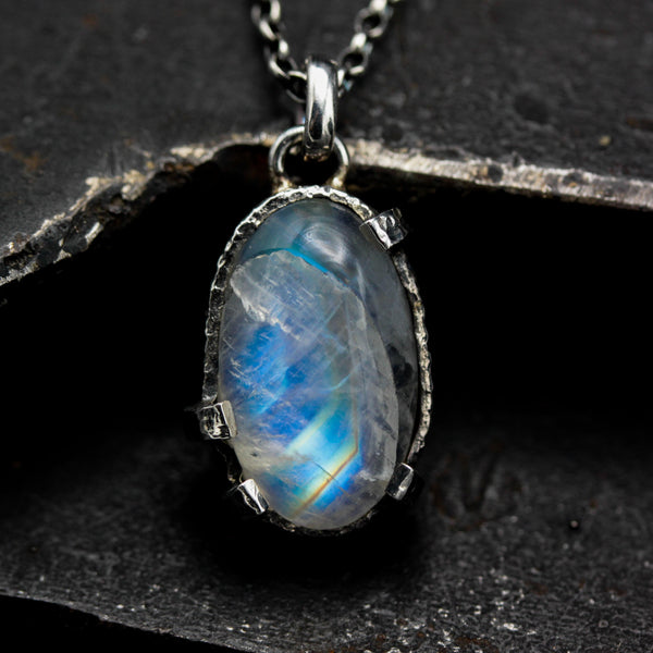 Oval moonstone pendant necklace in silver bezel and prongs setting