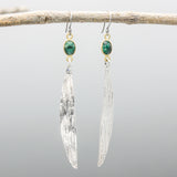 Oval Emerald earrings in bezel setting with silver leaf on oxidized sterling silver hooks style