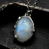 Cabochon Moonstone pendant necklace in silver bezel and prongs setting