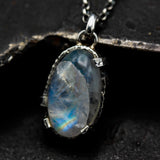 Oval moonstone pendant necklace in silver bezel and prongs setting