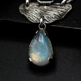 Teardrop Moonstone pendant necklace with silver leaf and oval tiny blue kyanite secondary