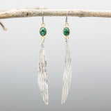 Oval Emerald earrings in bezel setting with silver leaf on oxidized sterling silver hooks style