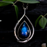 Labradorite teardrop cabochon pendant necklace set in silver bezel setting with a silver vine accent on a sterling silver chain