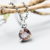 Elegant champagne spinel pendant necklace features a precision sterling silver bezel and prong setting