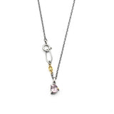 A vibrant rose pink spinel pendant necklace featuring a sterling silver bezel and prongs setting