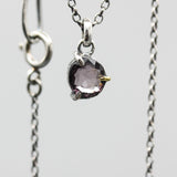 Sophisticated grey spinel pendant features a precision crafted sterling silver bezel and prong setting