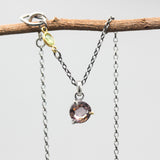 Elegant champagne spinel pendant necklace features a precision sterling silver bezel and prong setting