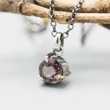 Elegant champagne spinel pendant necklace features a precision sterling silver bezel and prong setting