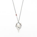Moonstone teardrop cabochon pendant necklace in silver bezel and prongs setting with silver vine design on sterling silver chain