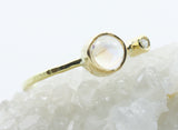 Round Opalescent Stone Ring in 18k Gold with Clear Accent — product view 4