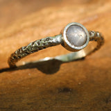 Sterling silver oxidized texture ring with round blue star sapphire in bezel setting at the center - Metal Studio Jewelry