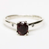 Red spinel oval faceted ring in prongs setting and diamond side set with sterling silver band - Metal Studio Jewelry
