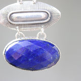 Oval faceted Lapis pendant necklace in silver bezel setting with oval silver engraving textured on sterling silver oxidized chain - Metal Studio Jewelry