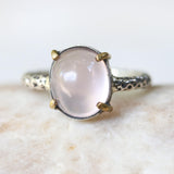 Rose quartz cocktail ring with silver heavily textured setting and brass accent prongs