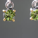 Earrings round faceted peridot in silver bezel and brass prongs setting with sterling silver hooks style - Metal Studio Jewelry