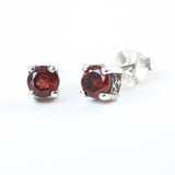 Sterling silver stud earrings with faceted garnet in prongs setting with sterling silver post and backing - Metal Studio Jewelry