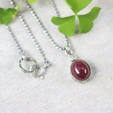 Ruby gemstone pendant necklace in silver bezel setting with tiny diamond on the top and oxidized sterling silver ball style chain - Metal Studio Jewelry