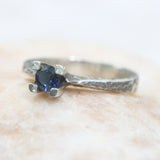 Tiny round faceted blue sapphire ring in silver prongs setting with sterling silver hard texture oxidized band - Metal Studio Jewelry