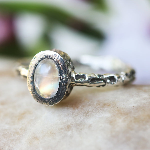 Sterling silver hard texture oxidized ring with tiny oval moonstone in silver bezel setting - Metal Studio Jewelry