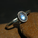 Oval cabochon moonstone ring in silver bezel setting with sterling silver oxidized hammer textured band - Metal Studio Jewelry