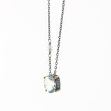 Blue topaz necklace in silver bezel and brass prongs setting with sterling silver cable chain