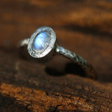 Oval cabochon moonstone ring in silver bezel setting with sterling silver oxidized textured band - Metal Studio Jewelry